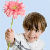 Image of child holding a flower