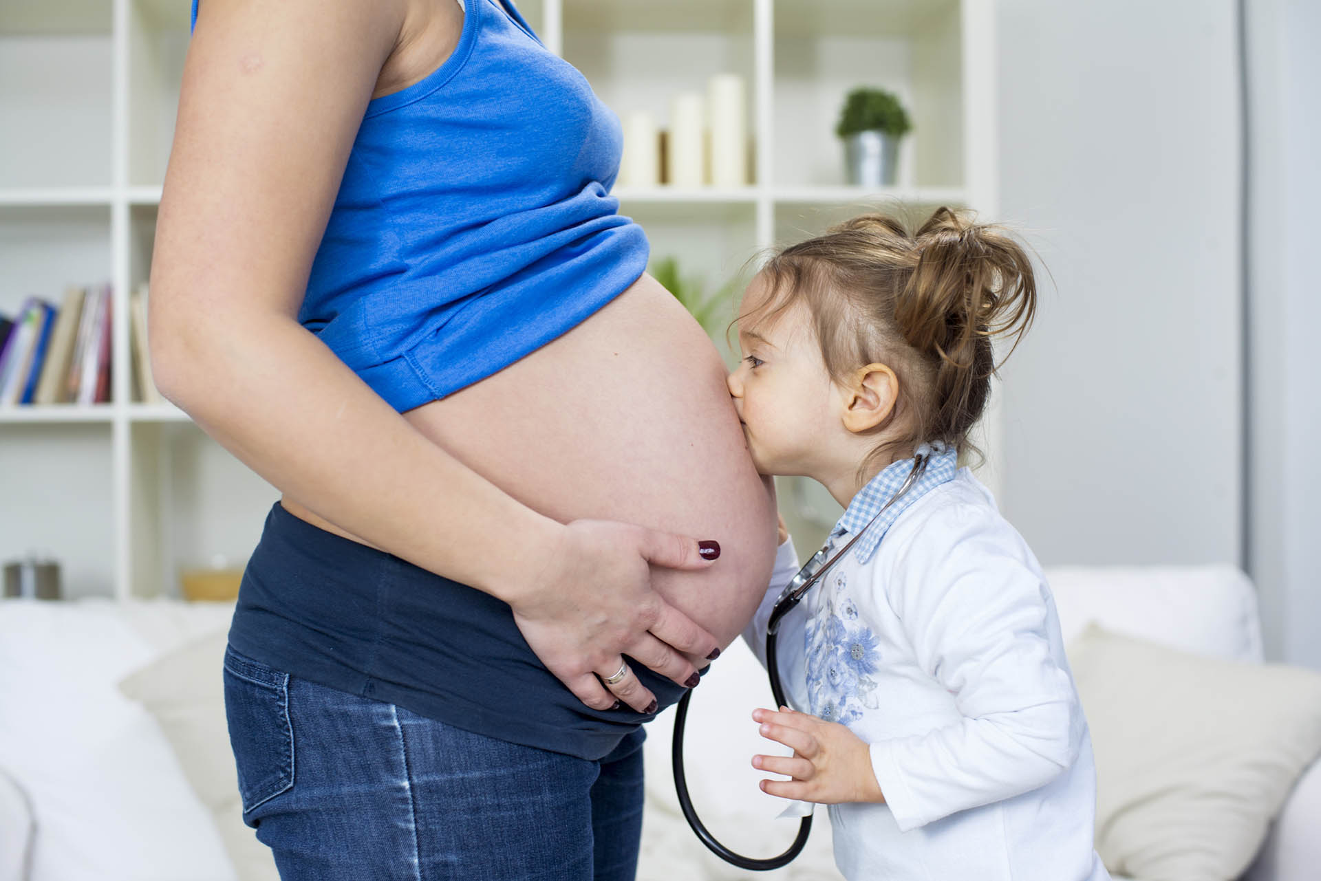 pregant mother and young daughter