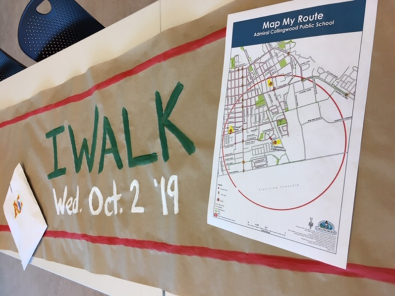 Image of an i walk event sign with a Map My Route document