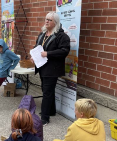 A facilitator standing in front of a few students