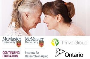 Older and younger woman smiling and touching foreheads