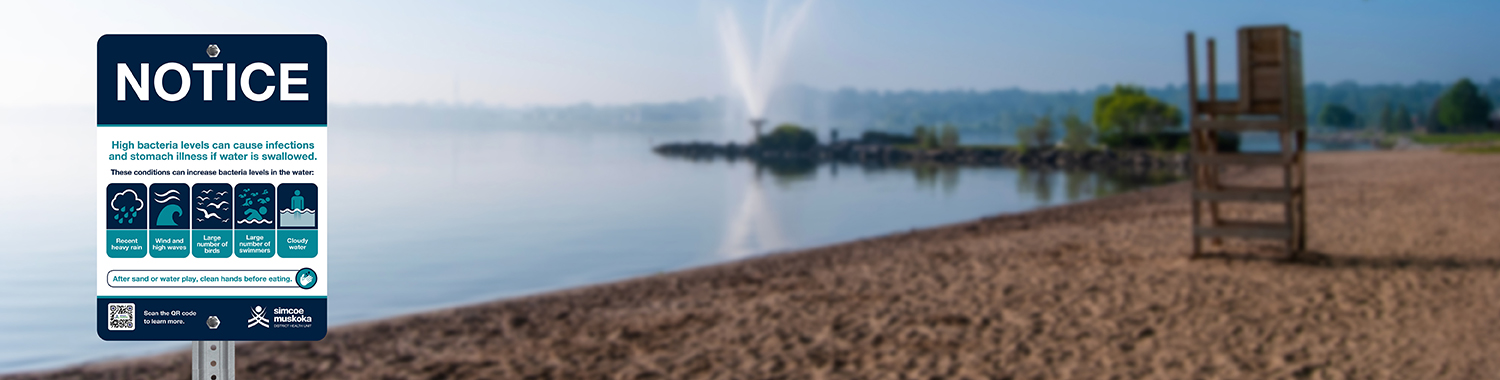 public beach with water safety sign