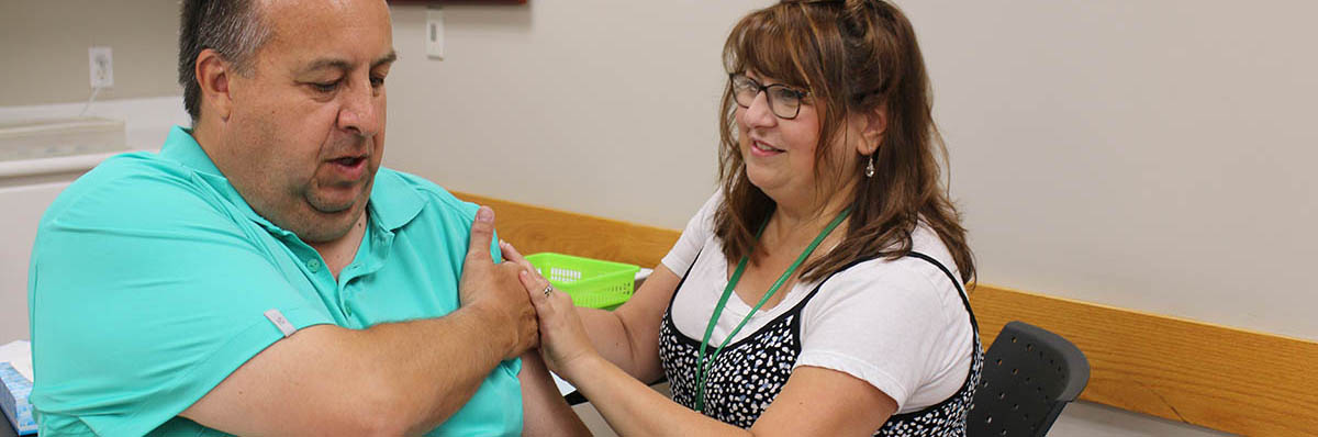 Adult male getting vaccine